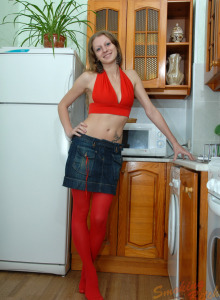 Smoking teen in long red stockings, red top and jeans skirt