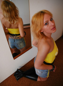 Girl in tight jeans shorts and tight yellow top