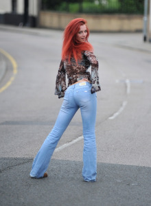 Redhead photographer in tight blue jeans