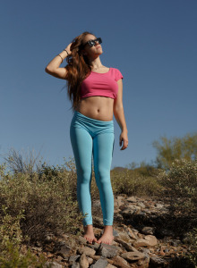 Amazing tasty girl is in the forest in cut jeans shorts and light blue spandex