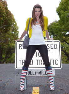 Sexy teen is outside in tight black spandex