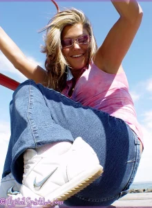 A girl with sexy apple ass in tight denim jeans