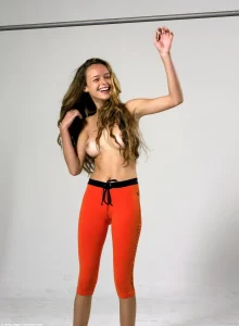 Amazing girl with perfect body wearing orange spandex with cameltoe
