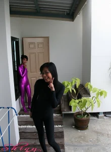 Asians in shiny outfits and pantyhoses