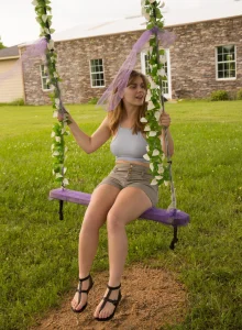 Busty baby is swinging in tight grey shorts