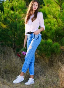 Casual beauty in tight blue jeans outdoor