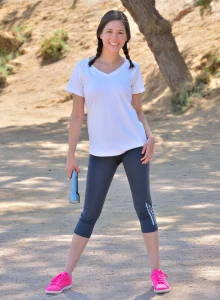 Playful girl is outside in grey spandex flashing her erected nipples, apple ass and hairy beaver