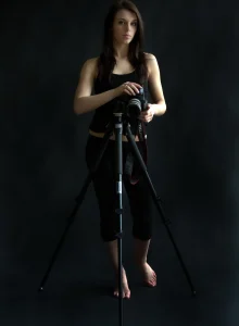 Wondeful young brunette photographer in black tight spandex has erected nipples and hairy beaver