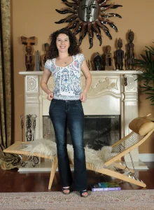 Wonderful girl in tight blue jeans has hairy beaver